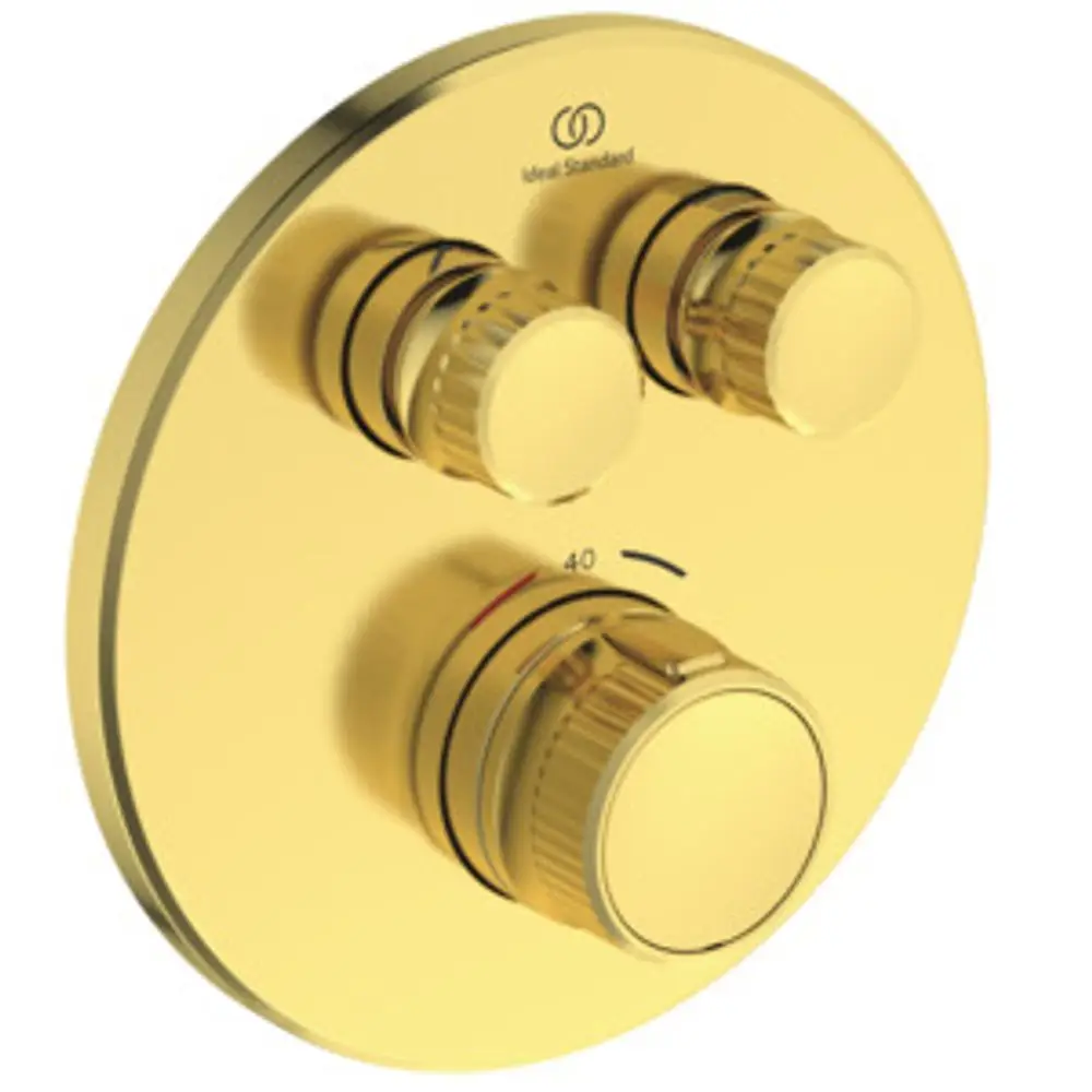 Brausethermostat in gebürstetem Gold mit drei Drehreglern. Markenlogo von Ideal Standard oben sichtbar. Flache, runde Form mit Temperaturanzeige.